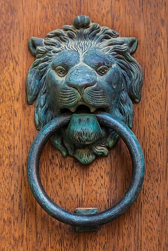 Messina Province-Caronia A bronze door knocker in the shape of a lion-in the medieval town Art Print